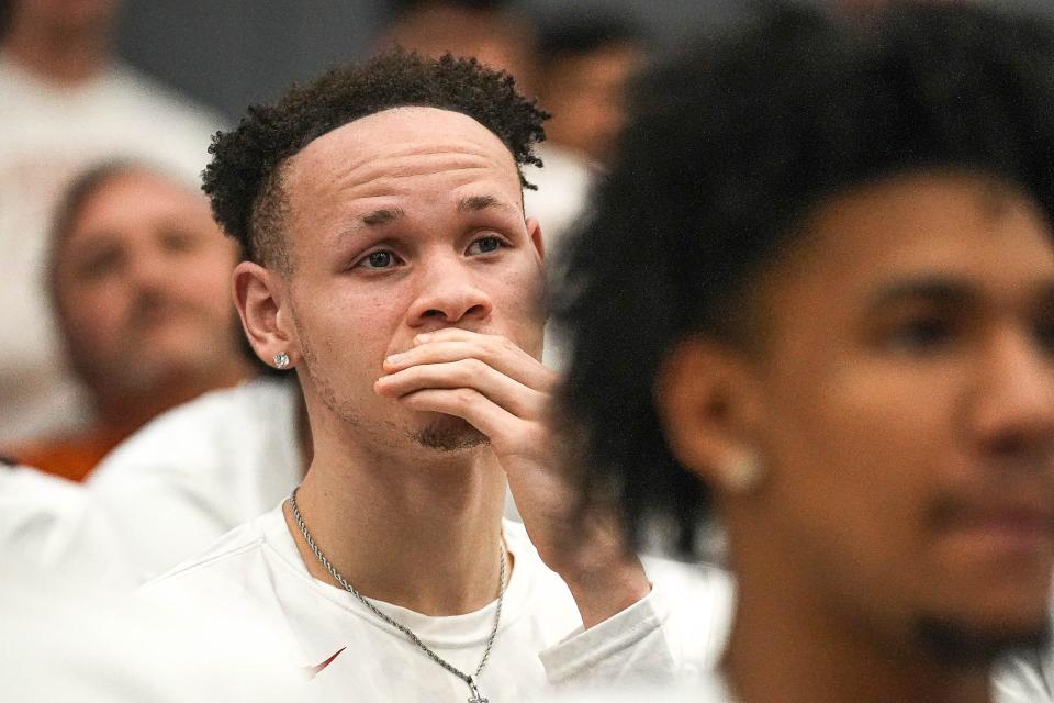 Texas guard Chendall Weaver watches the NCAA Tournament selection show Sunday at the Texas basketball practice facility. The Longhorns were selected as the seventh seed in the NCAA Midwest Region and will play either Colorado State or Virginia Thursday in Charlotte, N.C.