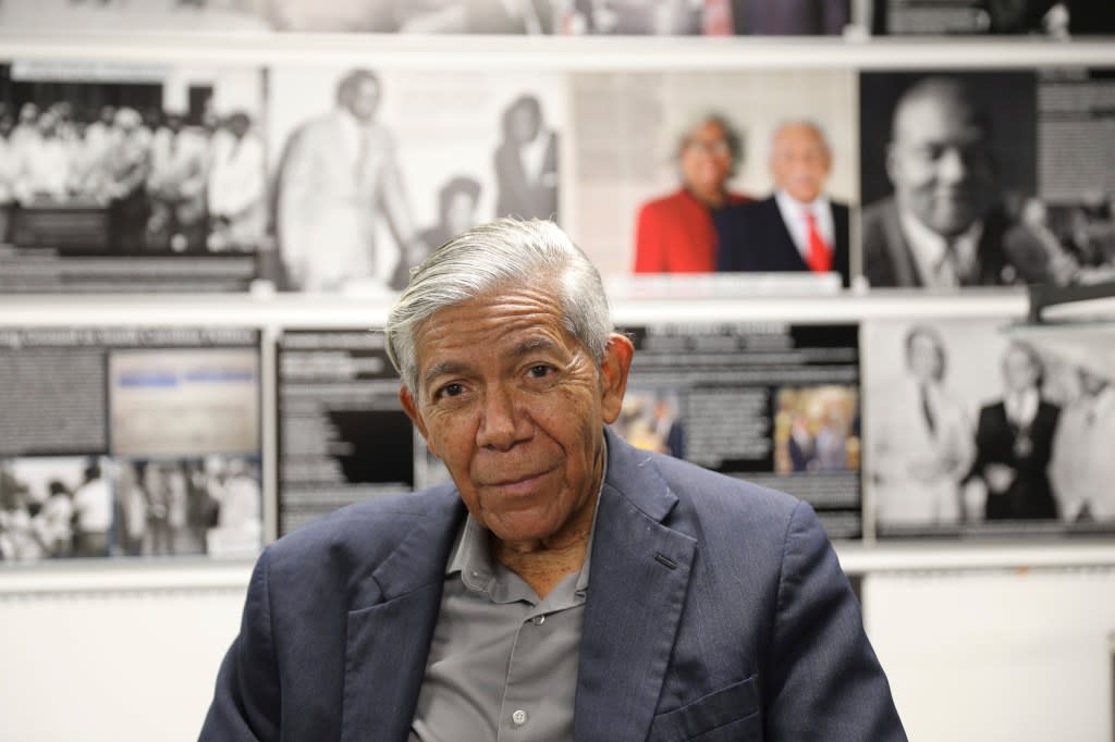 South Carolina civil rights photographer Cecil Williams sits in front of some of the displays he created for his museum, the only civil rights museum in the state, on Tuesday, Dec. 12, 2023, in Orangeburg, South Carolina. (AP Photo/Jeffrey Collins)