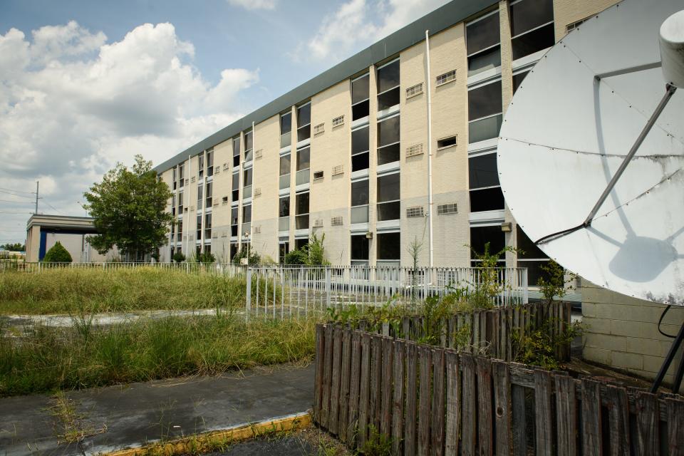 The site of the former Night Inn on Eastern Boulevard is set to be turned into 137 apartments for the homeless, but the developer behind the project has faced controversy in Asheville and California.