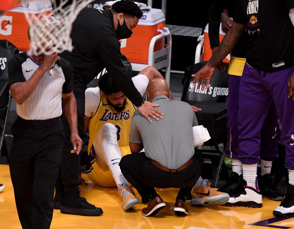 Los Angeles, CA - June 03:  Anthony Davis #3 of the Los Angeles Lakers sits on the court after a injury against the Phoenix Suns in the first half of game six of the Western Conference First Round NBA Playoff basketball game at the Staples Center in Los Angeles on Thursday, June 3, 2021. (Photo by Keith Birmingham/MediaNews Group/Pasadena Star-News via Getty Images)