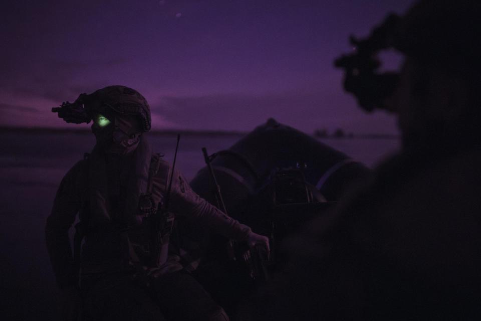 Ukraine Special Operations Forces soldiers navigate the Dnieper river using night vision goggles, or NVG, during a night mission in Kherson region, Ukraine, Saturday, June 10, 2023. (AP Photo/Felipe Dana)