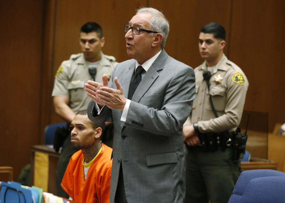 Geragos in court with longtime client Chris Brown in 2014. (Photo: Lucy Nicholson-Pool\Getty Images)