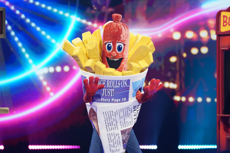 This image and the information contained herein is strictly embargoed until 00.01 Saturday 23rd January 2021

From Bandicoot TV

The Masked Singer: SR2: Ep5 on ITV

Pictured: Sausage.

This photograph is (C) Bandicoot TV and can only be reproduced for editorial purposes directly in connection with the programme or event mentioned above, or ITV plc. Once made available by ITV plc Picture Desk, this photograph can be reproduced once only up until the transmission [TX] date and no reproduction fee will be charged. Any subsequent usage may incur a fee. This photograph must not be manipulated [excluding basic cropping] in a manner which alters the visual appearance of the person photographed deemed detrimental or inappropriate by ITV plc Picture Desk.  This photograph must not be syndicated to any other company, publication or website, or permanently archived, without the express written permission of ITV Picture Desk. Full Terms and conditions are available on the website www.itv.com/presscentre/itvpictures/terms

For further information please contact:
james.hilder@itv.com / 0207 157 3052