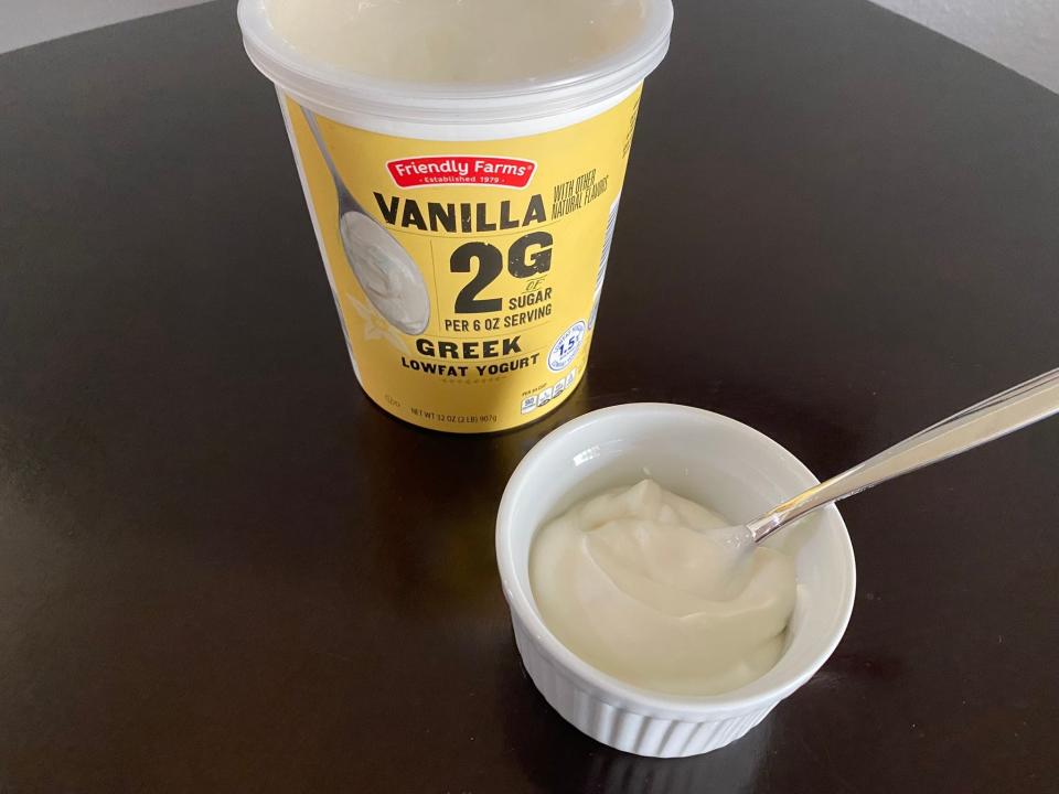 Friendly Farms vanilla Greek yogurt in a bowl with container