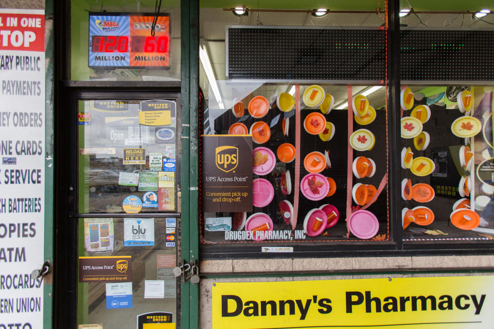 This 2014 photo provided by UPS shows one of their Access Point locations at Danny's Pharmacy in the Bronx borough of New York. The Access Point is one service UPS offers to help manage the flow of delivery packages. (UPS via AP)