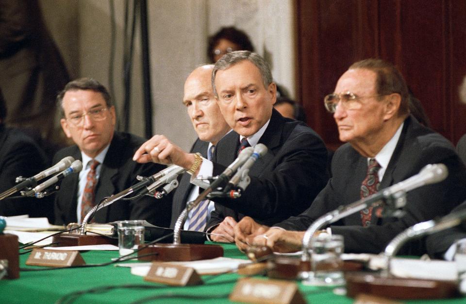 In this Oct. 11, 1991 file photo, Sen. Orrin Hatch, R-Utah, questions Professor Anita Hill in Washington during a Senate Judiciary Committee hearing on the nomination of Clarence Thomas to the Supreme Court. From left to right are Senators Charles Grassley,  R-Iowa, Sen. Alan Simpson, R-Wyo., Hatch, and Strom Thurmond, R-S.C.  