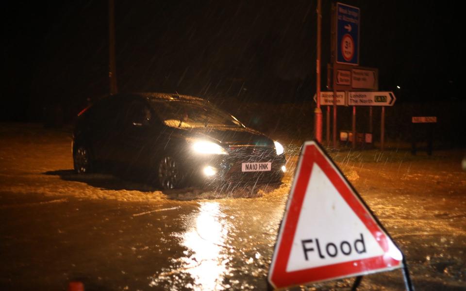 Floodwater in the village of Alconbury Weston as heavy rain has been falling for hours, causing the brook to burst over the banks and flood roads - Paul Marriott /Paul Marriott Photography 