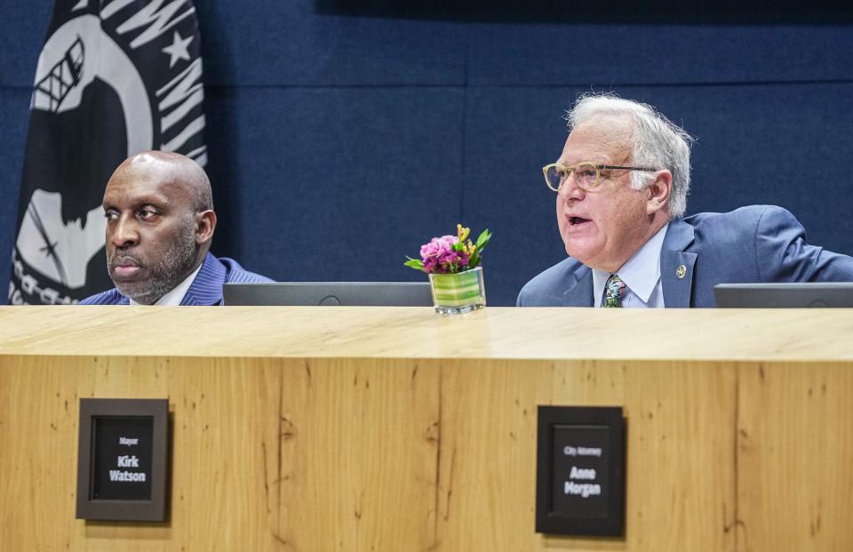 Mayor Kirk Watson speaks last Thursday during T.C. Broadnax's, left, first Austin City Council meeting as the city manager.