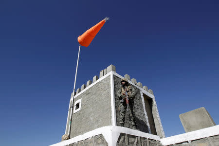 A soldier stands guard at the Angoor Adda outpost along the border fence on the border with Afghanistan in South Waziristan, Pakistan October 18, 2017. REUTERS/Caren Firouz