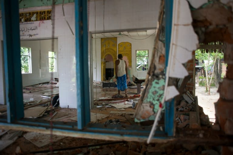 Scores of Buddhists ransacked the mosque after a dispute between neighbours spilled into religious violence