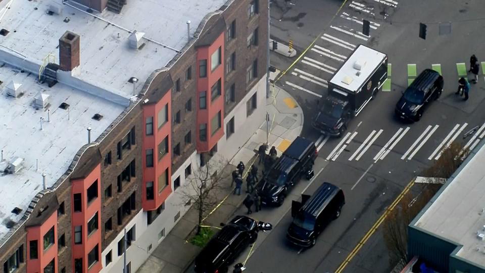 Firefighters, police, a bomb squad and a hazmat team were called to an apartment building in Seattle's Lower Queen Anne neighborhood for reports of an explosion and fire.