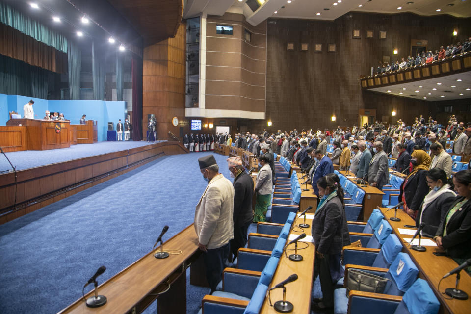 Members of parliament pay respect to martyrs as they begin session in Kathmandu, Nepal, Sunday, March 7, 2021. Nepal’s Parliament reinstated by the nation's Supreme Court began session on Sunday that would likely determine the future of the prime minister and government. (AP Photo/Niranjan Shrestha)