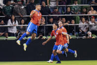 Chile forward Ivan Morales (11) celebrates his goal with Marcelino Nunez (10) and Clemente Montes (28) during the first half of an international friendly soccer match against Mexico, Wednesday, Dec. 8, 2021, in Austin, Texas. (AP Photo/Michael Thomas)