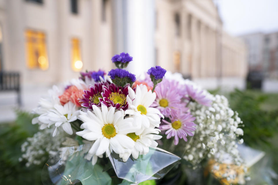 Flowers in memory of fallen law enforcement officers are seen at the base of a flagpole outside the federal courthouse on April 30, 2024, in Charlotte, North Carolina. / Credit: Sean Rayford/Getty Images