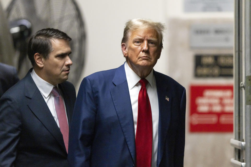 Former President Donald Trump and his attorney Todd Blanche return to the courtroom after a break for his trial at Manhattan criminal court in New York, Tuesday, April 30, 2024. (Justin Lane/Pool Photo via AP)