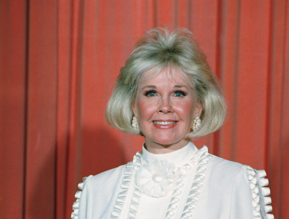 FILE - In this Jan. 28, 1989 file photo, actress and animal rights activist Doris Day poses for photos after receiving the Cecil B. DeMille Award she was presented with at the annual Golden Globe Awards ceremony in Los Angeles, Calif. Day is celebrating a landmark birthday with an auction to benefit her favorite cause: animals. A spokesman for Day said Tuesday, March 11, 2014, the nonprofit Doris Day Animal Foundation will mark her 90th birthday in April with a bash in Carmel, Calif. (AP Photo, file)