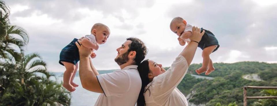 Nicolas del Rosal holds son Mateo while wife holds his twin Celeste inAugust 2022. They were born prematurely in December 2021, followed a year later by the couple's second set of twins.