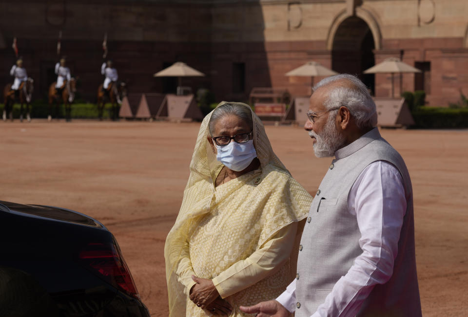 Indian Prime Minister Narendra Modi, right, talks with his Bangladeshi counterpart Sheikh Hasina during her ceremonial reception at the Indian presidential palace in New Delhi, India , Tuesday, Sept. 6, 2022. Bangladesh's prime minister was welcomed to India with a ceremony in the capital, New Delhi, on Tuesday during a four-day visit aimed at boosting bilateral ties. (AP Photo/Manish Swarup)