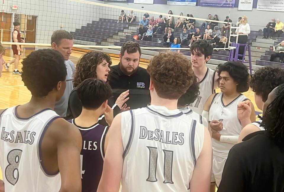 DeSales coach Andrea Navar talks to her team during a match against Watterson on Tuesday at home. DeSales won in four sets.