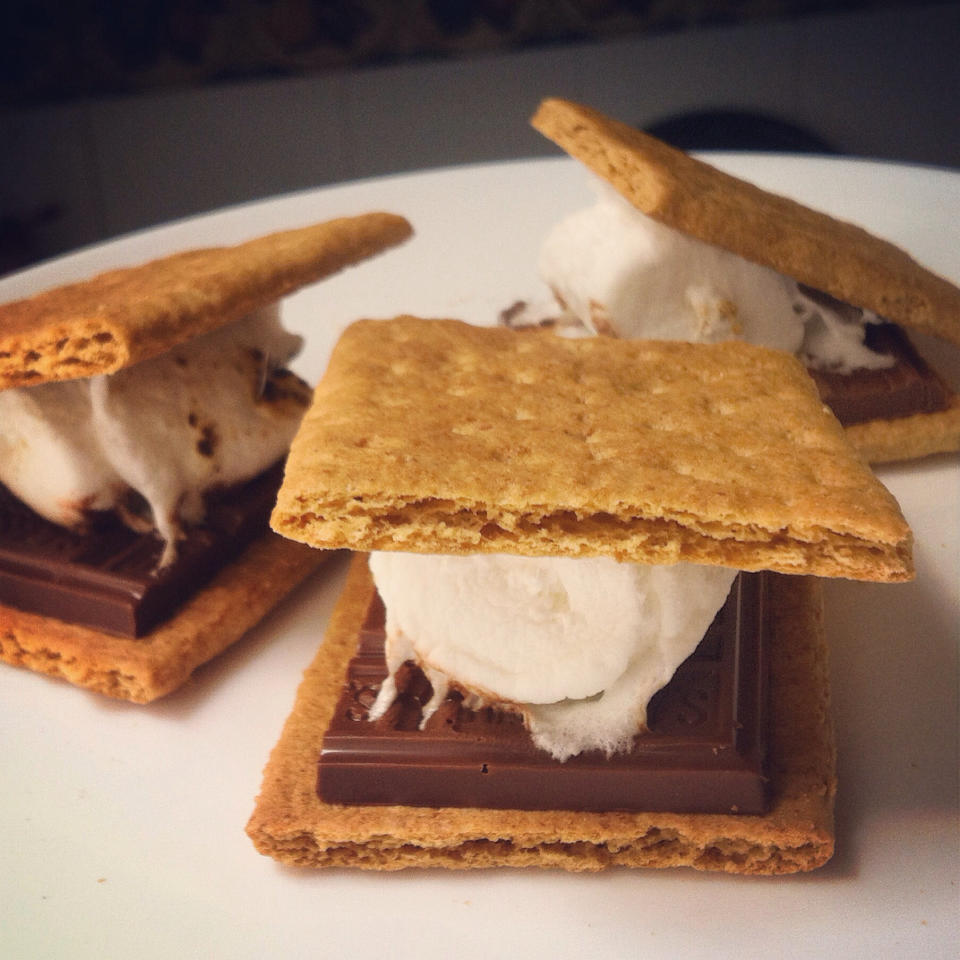 Three s'mores on a plate.