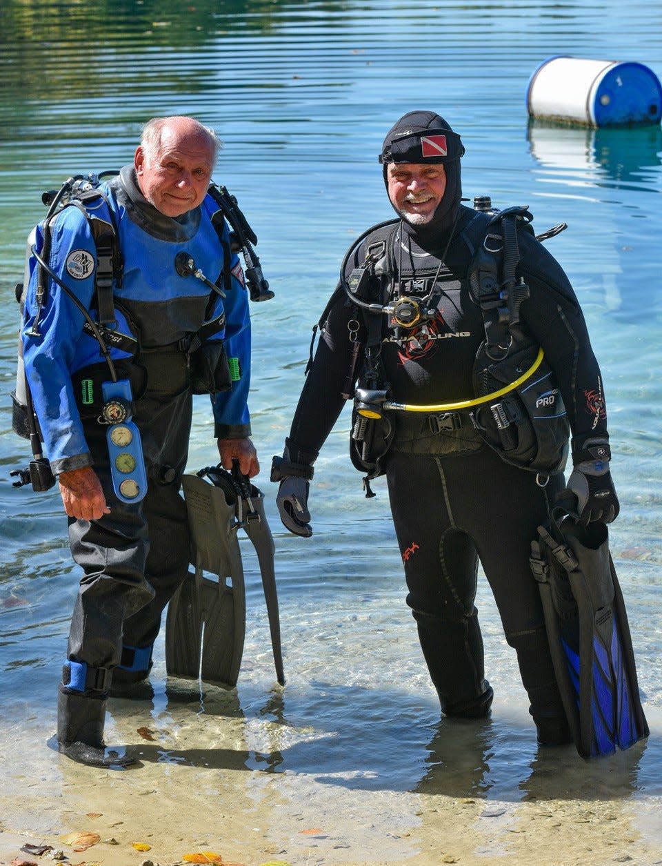 Ron Smith, left, and Craig Whitaker, both members of Bay Area Divers, get suited up for a dive at White Star Quarry in Gibsonburg on Oct. 2.