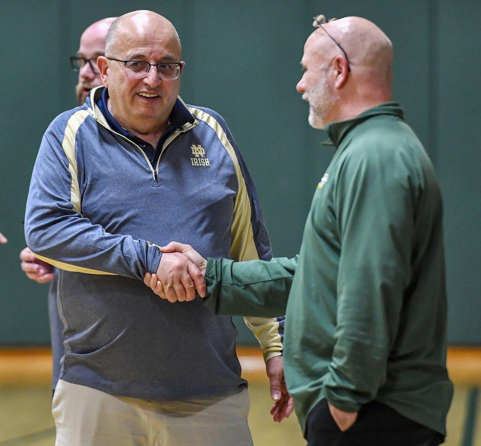 Mike Rapone, left, has coached at Batavia Notre Dame, his alma mater, since 1980.