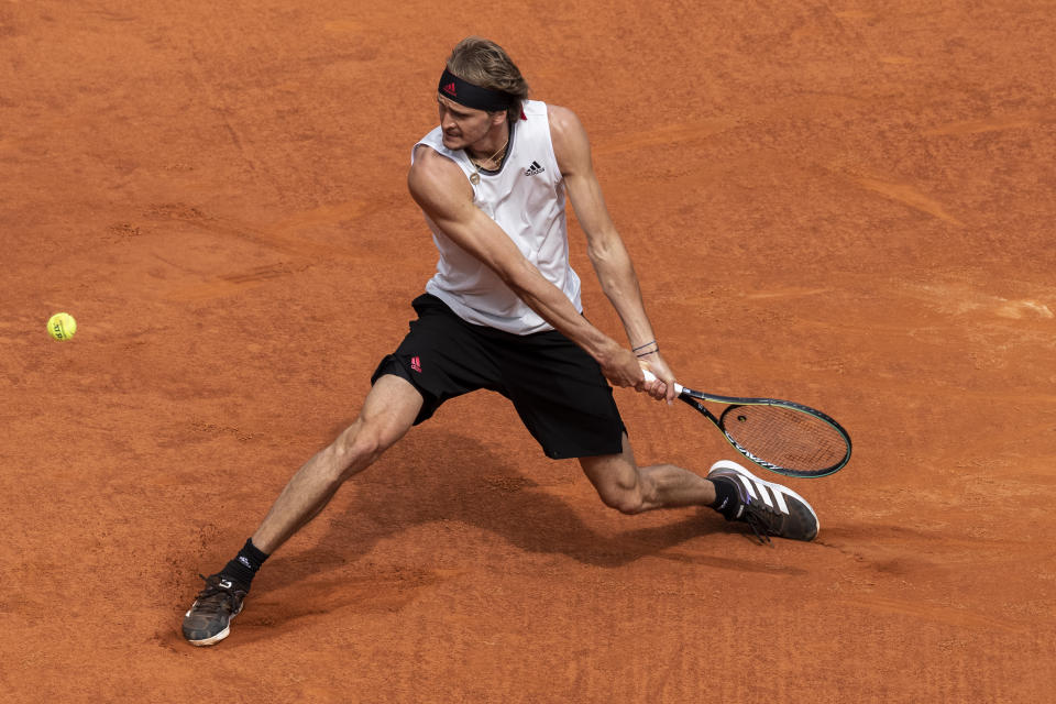 Germany's Alexander Zverev returns the ball to Austria's Dominic Thiem during their semi-final match at the Mutua Madrid Open tennis tournament in Madrid, Spain, Saturday, May 8, 2021. (AP Photo/Bernat Armangue)