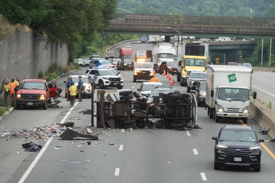 An accident between a pick up truck and a box truck caused traffic delays on Route 80 westbound in Teaneck, NJ on Tuesday morning June 20, 2023. The box truck overturned in the local lanes of Route 80 with only the left lane getting past the accident scene. 