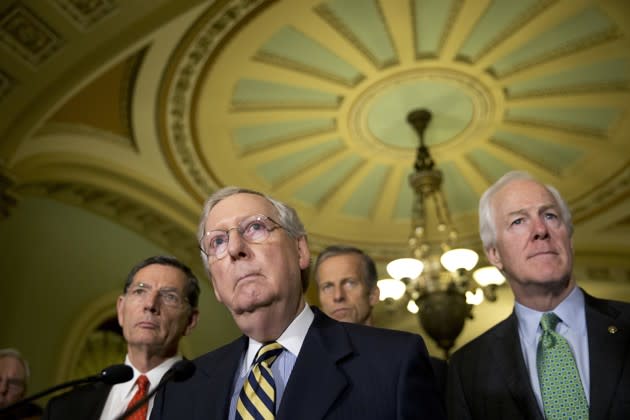 Majority Leader Mitch McConnell in the foreground, with other members of the Republican Senate leadership: (from left) John Barrasso, John Thune, and John Cornyn. This isn’t a picture of McConnell with his party’s presumptive nominee, because if such a photo exists, Google doesn’t know about it. (AP photo)