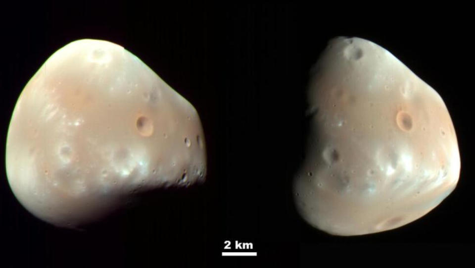 A true-color image of Deimos, a small Martian moon, set against a completely black background.