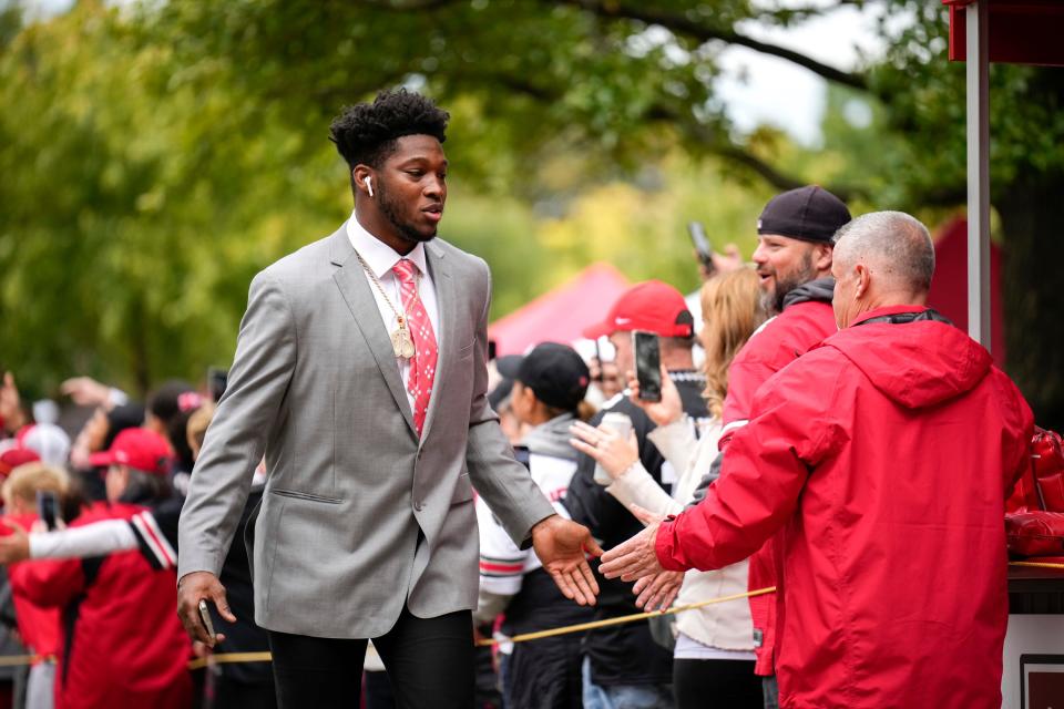 Ohio State defensive end Javontae Jean-Baptiste walks into Ohio Stadium prior to a game against Rutgers.