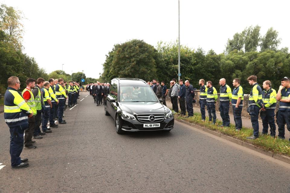 Employees formed a guard of honour to the funeral cortege of Sir William Wright (Liam McBurney/PA) (PA Wire)