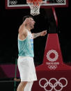 Slovenia's Luka Doncic (77) celebrates score during men's basketball quarterfinal game against Germany at the 2020 Summer Olympics, Tuesday, Aug. 3, 2021, in Saitama, Japan. (AP Photo/Eric Gay)