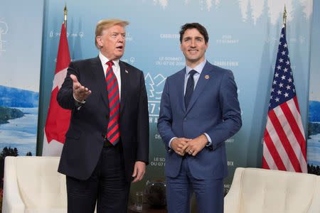 FILE PHOTO - Canada's Prime Minister Justin Trudeau (R) meets with U.S. President Donald Trump during the G7 Summit in the Charlevoix town of La Malbaie, Quebec, Canada, June 8, 2018. REUTERS/Christinne Muschi