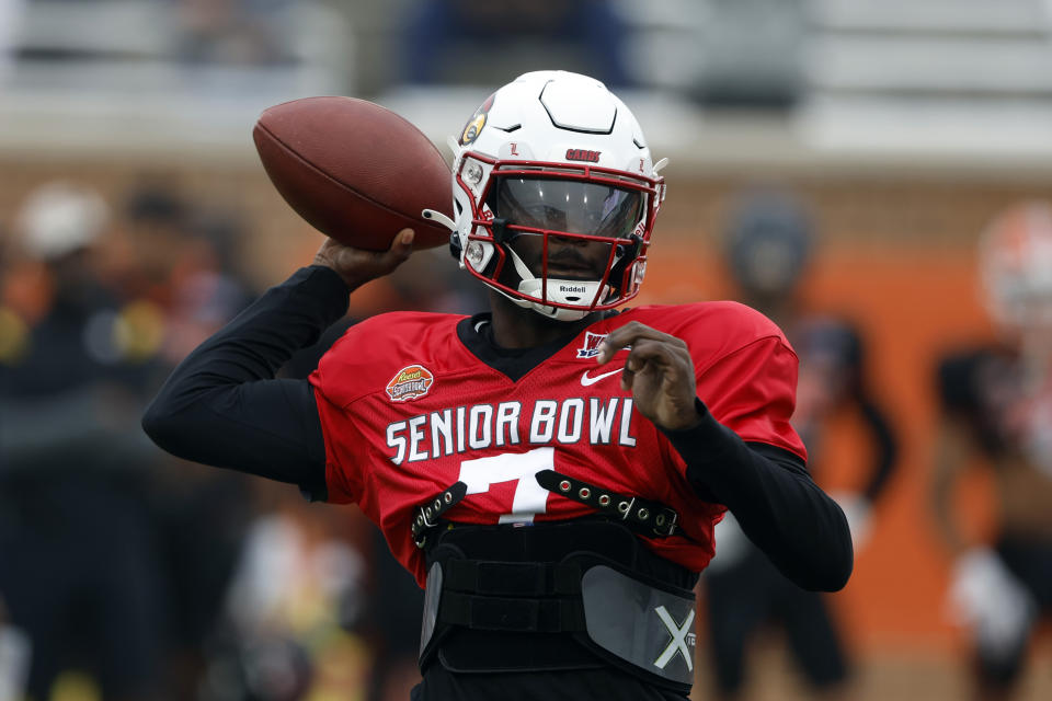 National quarterback Malik Cunningham of Louisville throws a pass during practice for the Senior Bowl NCAA college football game Thursday, Feb. 2, 2023, in Mobile, Ala.. (AP Photo/Butch Dill)