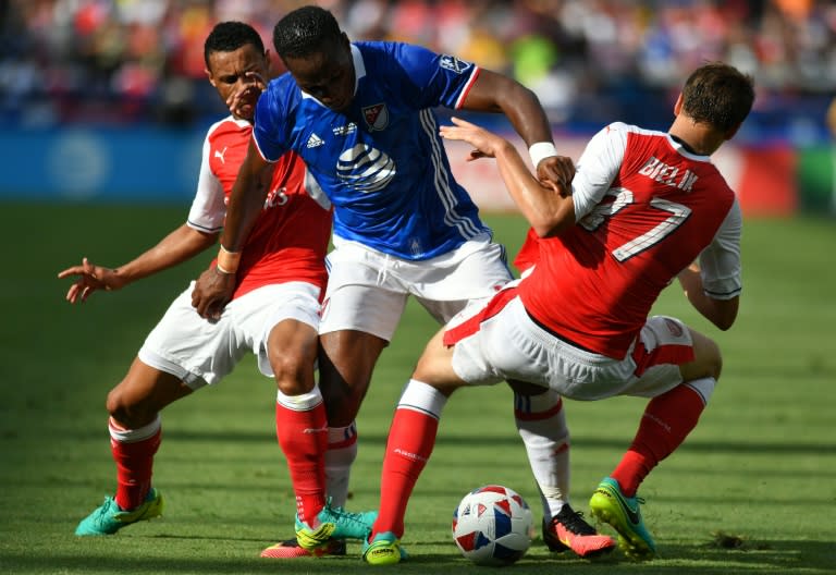 Montreal Impact's Didier Drogba (C) fights for the ball with Arsenal's Krystian Bielik during an MLS All-Star match at Avaya Stadium in San Jose, California, in July 2016