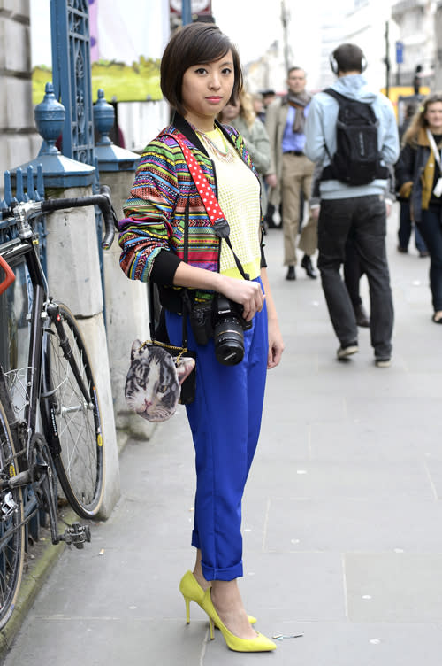 <b>LFW Street Style</b><br><br>Freelance retail designer Rosie poses wearing Topshop shoes, American Apparel trousers, Top Shop top, H+M jacket with a necklace from New Look outside the John Rocha catwalk show.<br><br>©PA