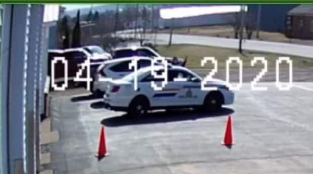 Thinking they had spotted the gunman in last year's shooting rampage, two RCMP officers opened fire at the Onslow Belmont Fire Brigade on the morning of April 19. The fire hall was being used as a shelter.  (Onslow Belmont Fire Brigade surveillance cameras - image credit)