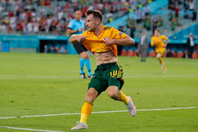 Wales reached the last 16 with an impressive win over Turkey in Baku, Aaron Ramsey scoring their opening goal