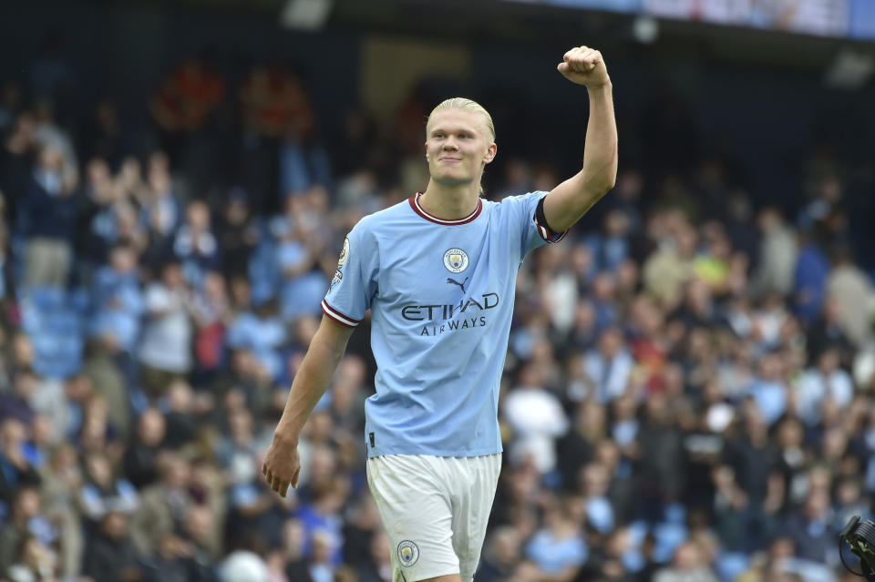 Manchester City's Erling Haaland celebrates at the end of the English Premier League soccer match between Manchester City and Manchester United at Etihad stadium in Manchester, England, Sunday, Oct. 2, 2022. Manchester City won 6-3 and he scored an hat trick. (AP Photo/Rui Vieira)