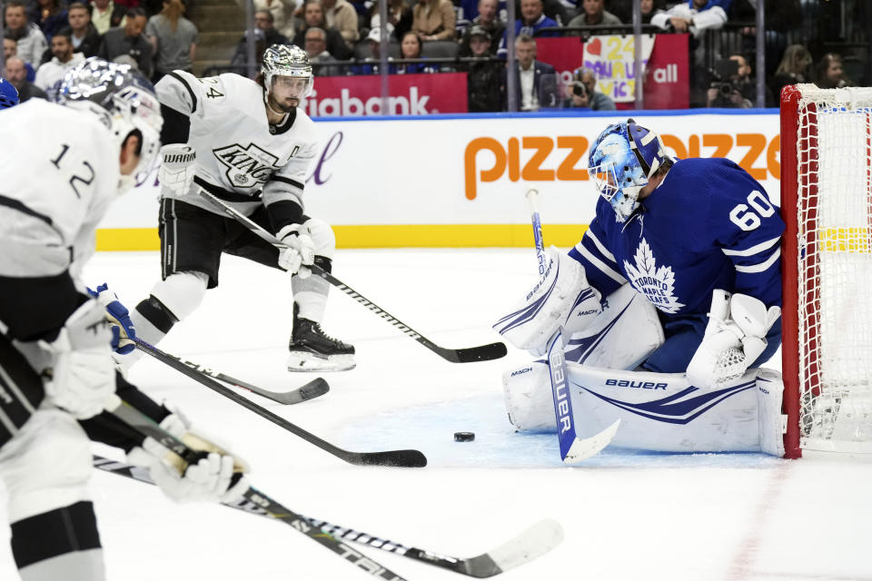 Los Angeles Kings' Phillip Danault (24) skates in to score against Toronto Maple Leafs goaltender Joseph Woll during the first period of an NHL hockey game, Tuesday, Oct. 31, 2023 in Toronto. (Chris Young/The Canadian Press)