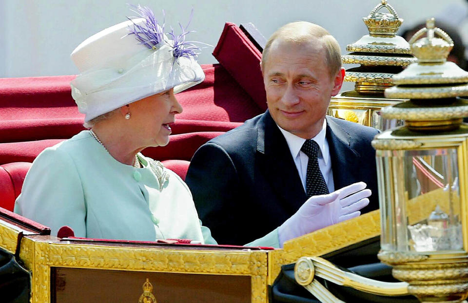 <p>The Queen and Russian president Vladimir Putin in an open carriage after he was given a ceremonial welcome on Horse Guards Parade on 24 June 2003. (Reuters)</p> 