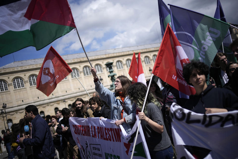 Students gather at the Pantheon monument Friday, May 3, 2024 in Paris. Students waved Palestinian flags and chanted slogans in support of residents of Gaza, as Israel continues its offensive following the deadly Oct. 7 Hamas-led attack that triggered the Israeli-Hamas war. (AP Photo/Christophe Ena)