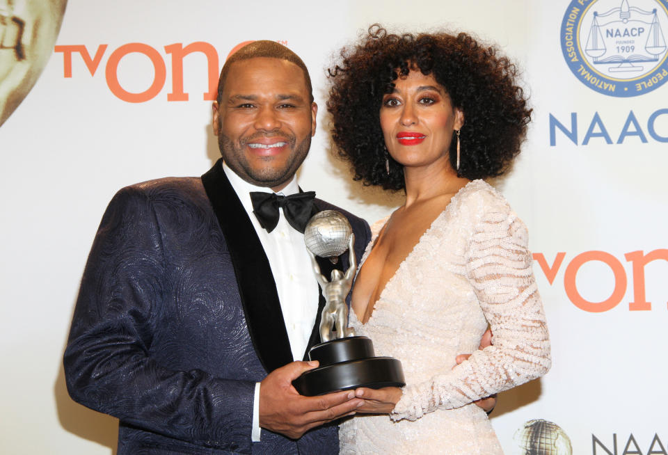 Anthony Anderson, left, and Tracee Ellis Ross pose in the press room with the award for outstanding comedy series for "Black-ish" at the 46th NAACP Image Awards at the Pasadena Civic Auditorium on Friday, Feb. 6, 2015, in Pasadena, Calif. (Photo by Arnold Turner/Invision/AP)