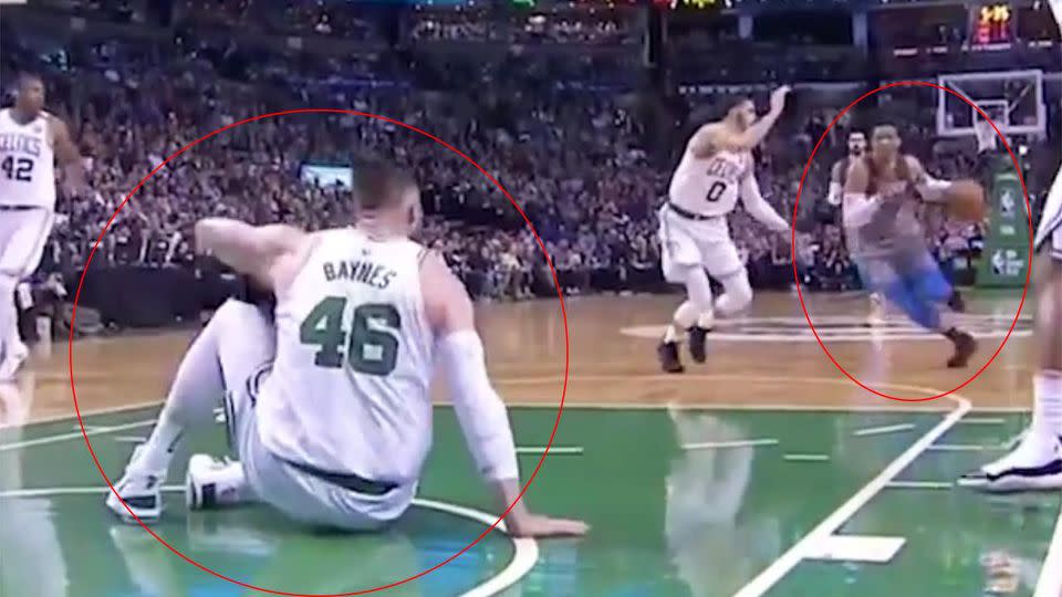 Baynes sits on the court as Westbrook charges at him. Pic: ESPN