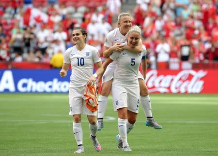 Jun 27, 2015; Vancouver, British Columbia, CAN; England defender Steph Houghton (5) celebrates with teammates after defeating Canada in the quarterfinals of the FIFA 2015 Women's World Cup at BC Place Stadium. England won 2-1. Mandatory Credit: Matt Kryger-USA TODAY Sports