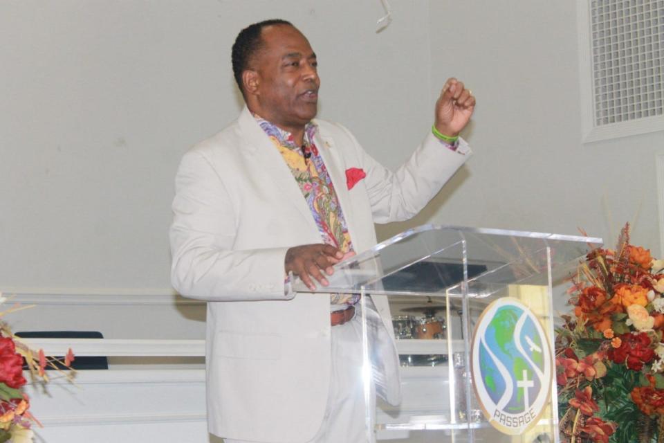 Pastor George B. Dix. Jr., senior pastor and co-founder of PASSAGE Family Church, delivers the sermon during the church's Family and Friends 
Day service on Sunday.