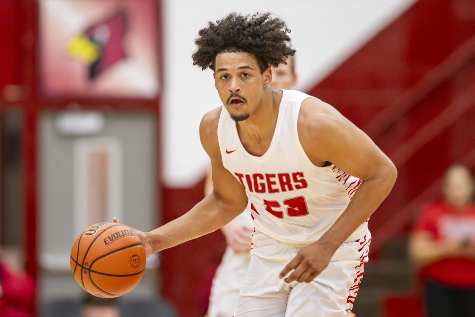 Fishers High School senior Keenan Garner (23) brings the ball up court during the first half of a game in the Forum Tipoff Classic against Kokomo High School, Saturday, Dec. 9, 2023, at Southport High School.