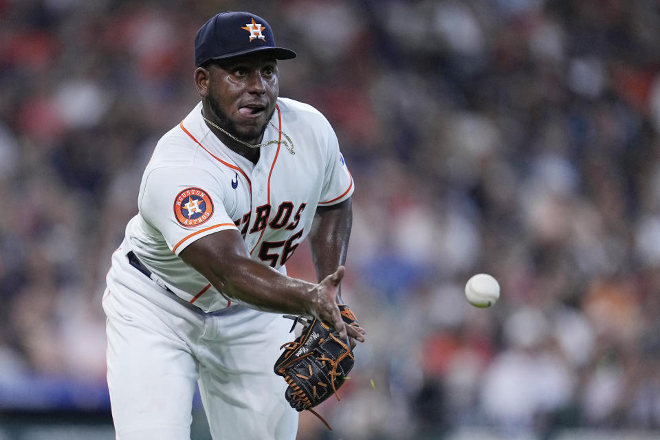 Houston Astros starting pitcher Ronel Blanco tosses a comebacker from Cleveland Guardians' Steven Kwan to first base for an out during the fourth inning of a baseball game, Wednesday, Aug. 2, 2023, in Houston. (AP Photo/Kevin M. Cox)