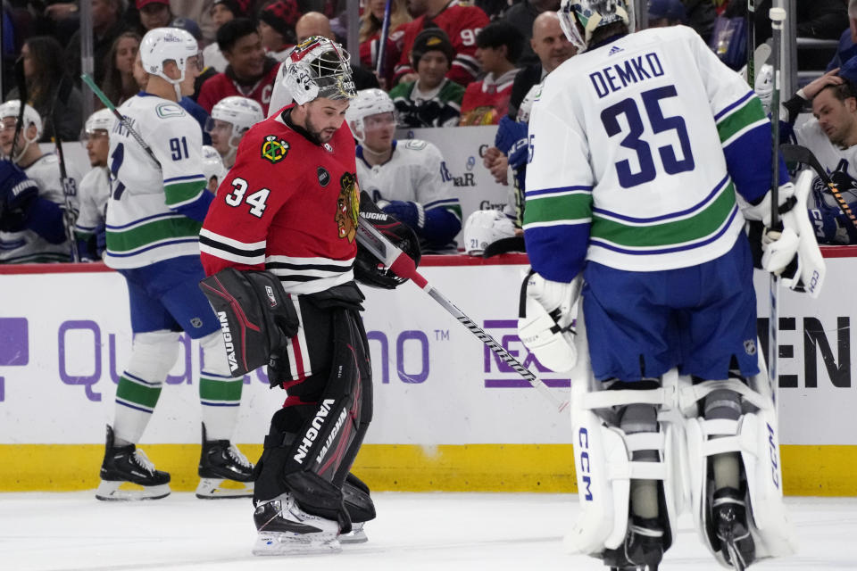 Chicago Blackhawks goaltender Petr Mrazek (34) skates to the bench during the second period of an NHL hockey game against the Vancouver Canucks in Chicago, Sunday, Dec. 17, 2023. (AP Photo/Nam Y. Huh)